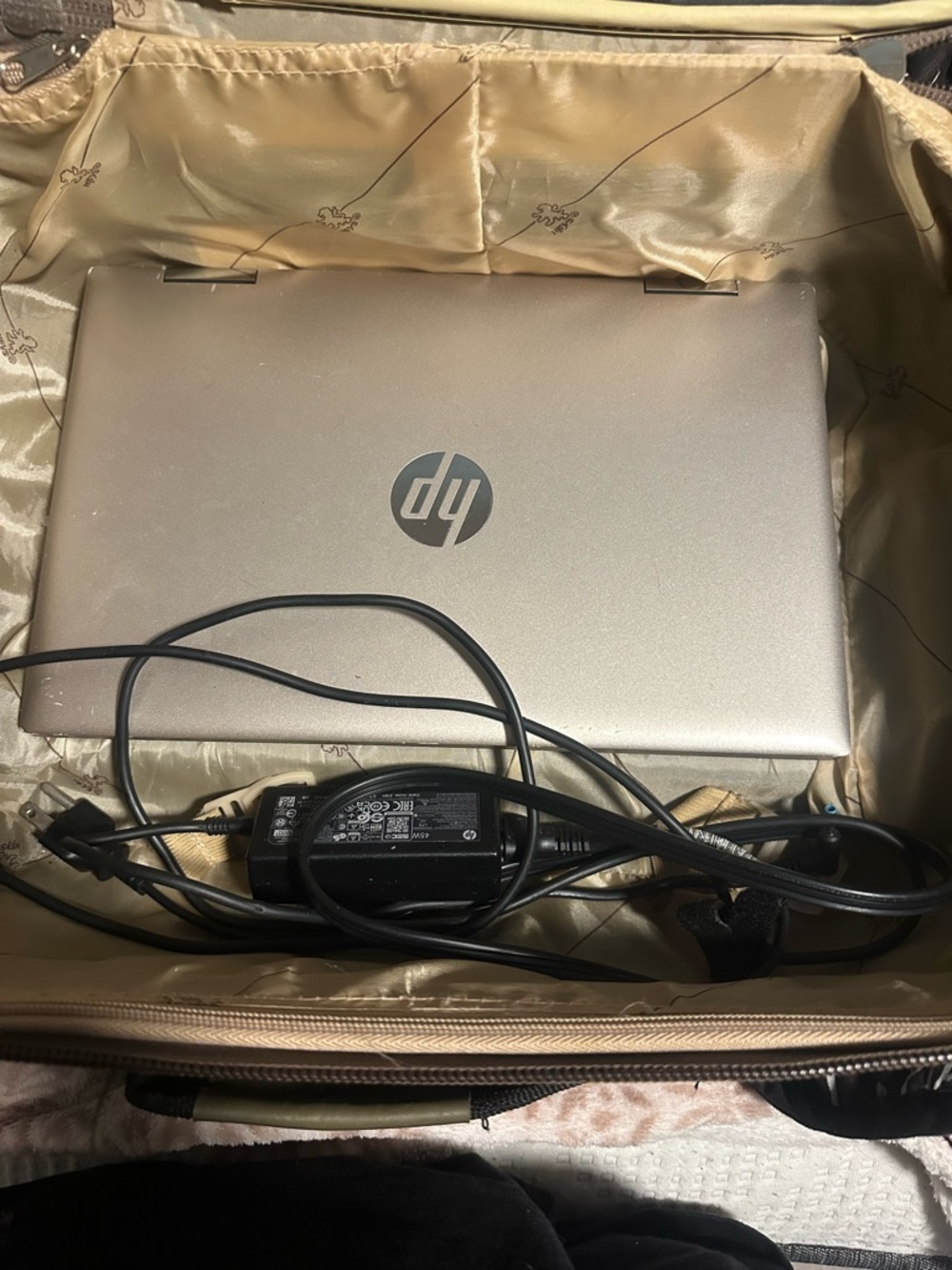 HP Silver Laptop with Charger and Sleek HP Logo